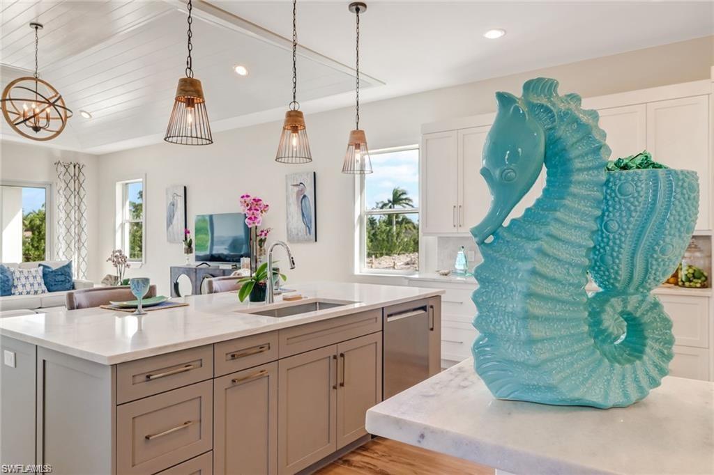 147 Cambria Lane Naples, FL 34112 - Photo 2 of 3 a bathroom with a sink and mirror