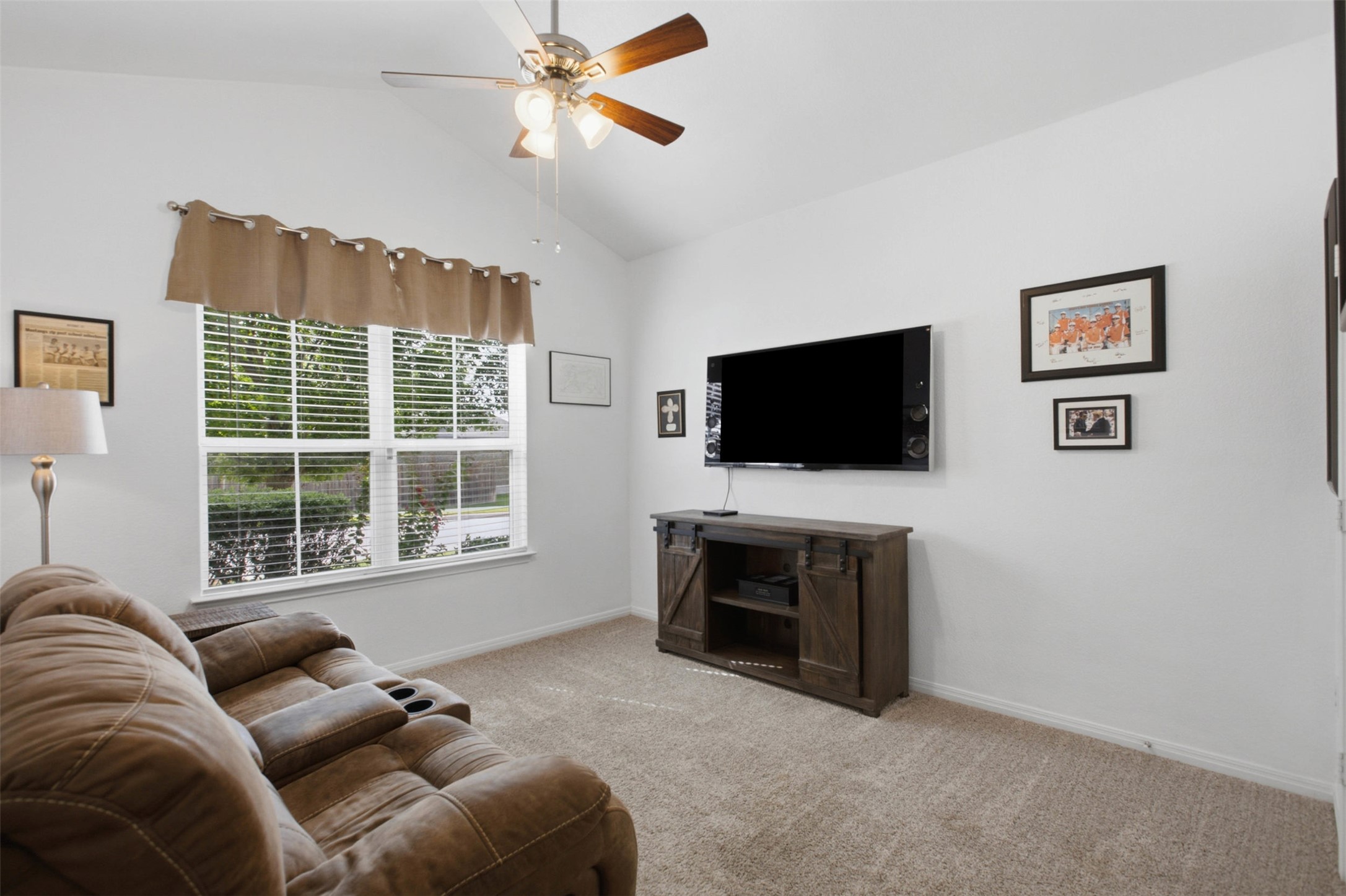 2413 Bridges Ranch Road Georgetown, TX 78628 - Photo 23 of 31 A well-lit living area offers comfort and views of the neighborhood through a broad window.