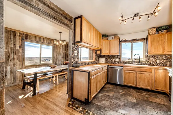 a open kitchen with stainless steel appliances granite countertop a stove and cabinets