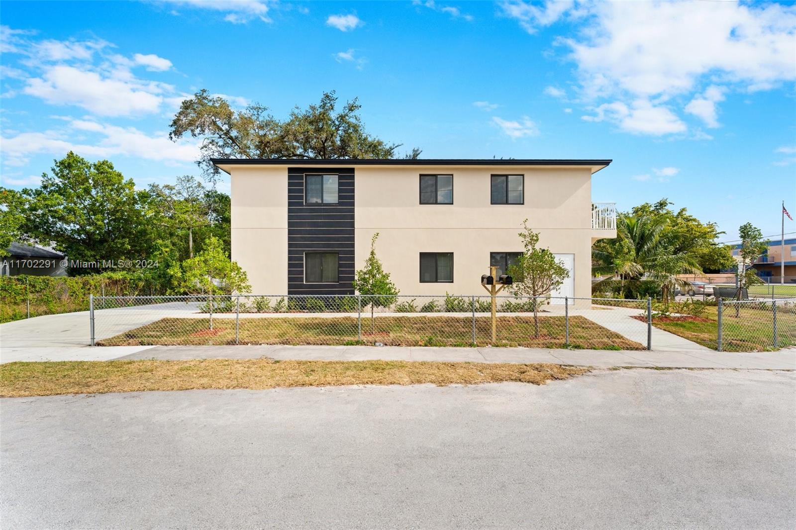 1999 Northwest 46th Street Miami, FL 33142 - Photo 1 of 22 a view of a house with a swimming pool