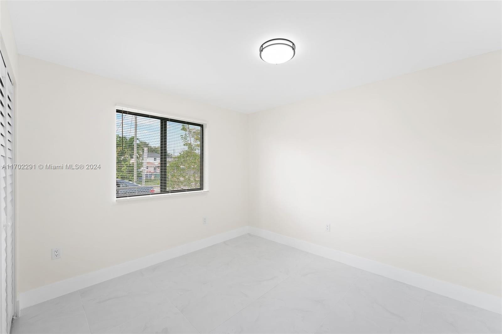1999 Northwest 46th Street Miami, FL 33142 - Photo 12 of 22 an empty room with windows
