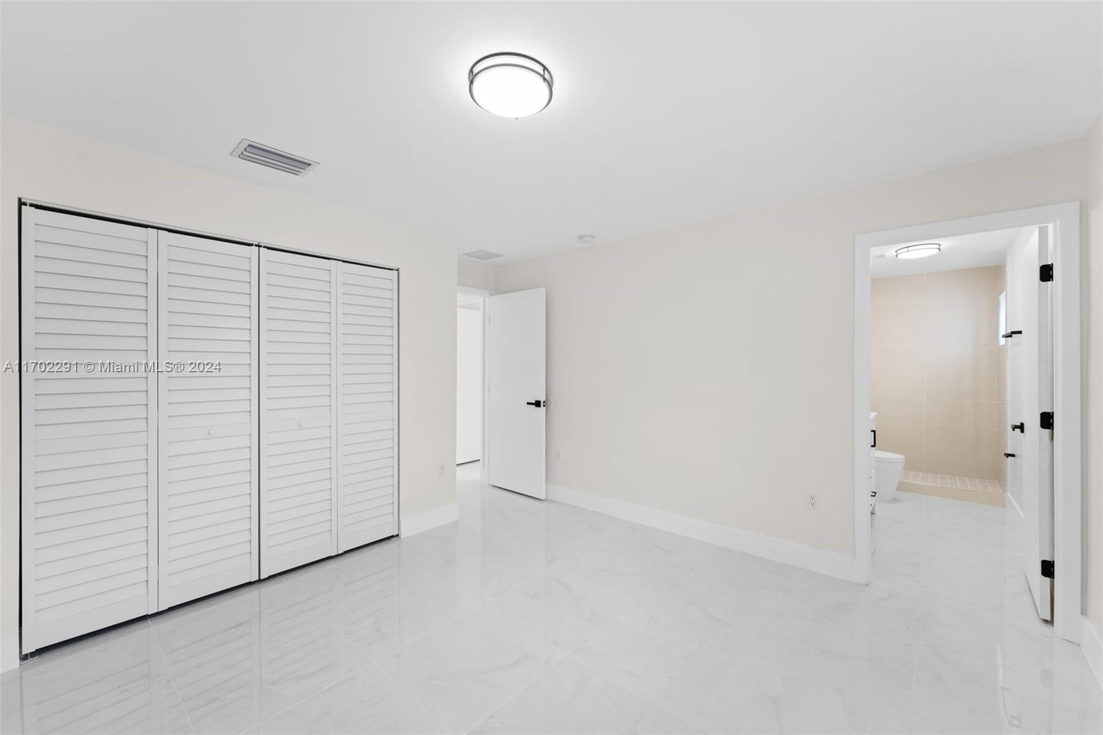 1999 Northwest 46th Street Miami, FL 33142 - Photo 15 of 22 an empty room with closet