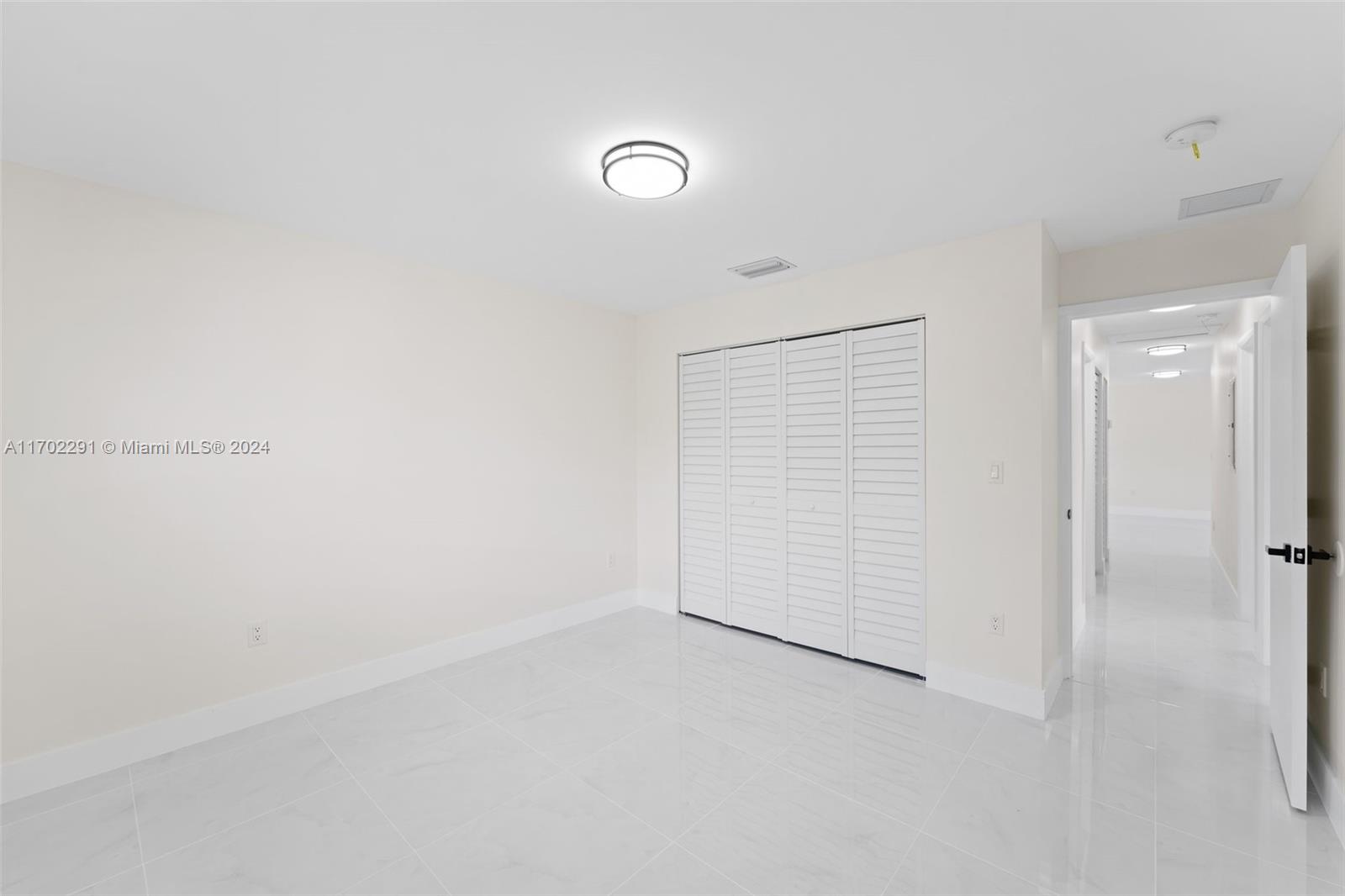 1999 Northwest 46th Street Miami, FL 33142 - Photo 21 of 22 a view of an empty room