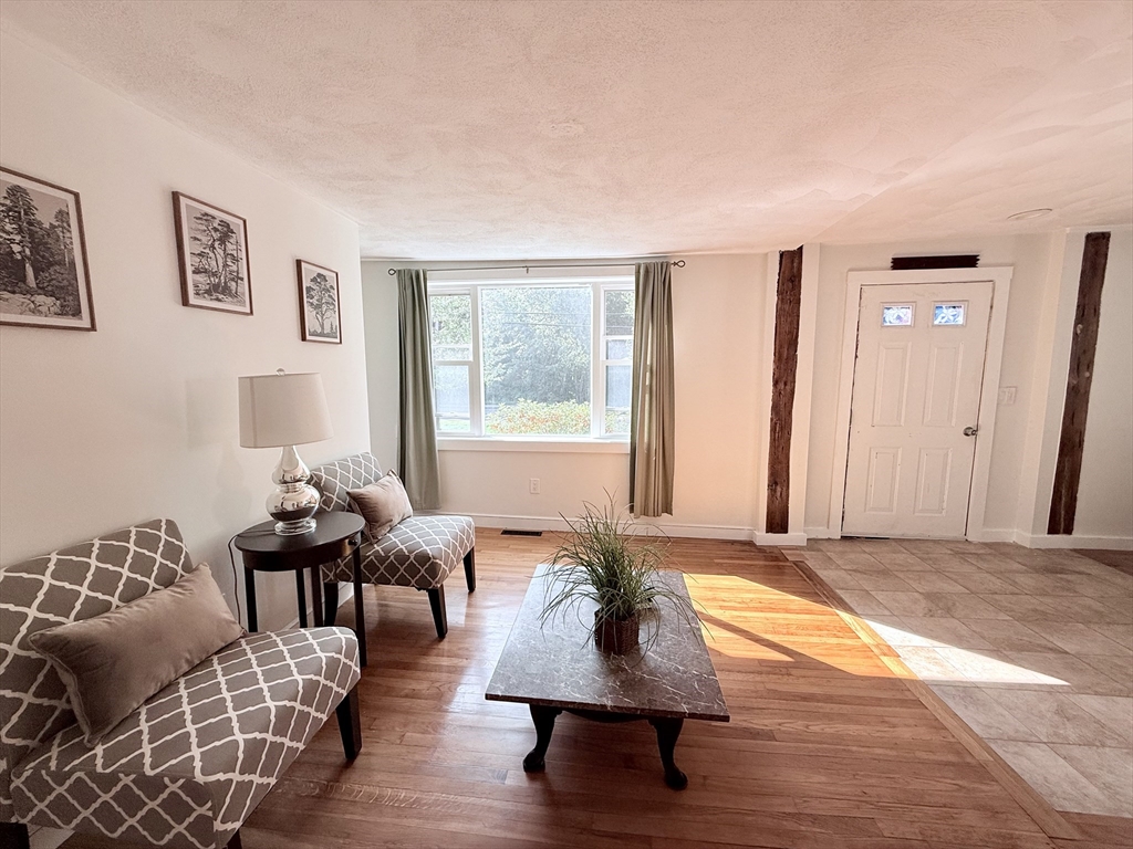 975 South Main Street Bellingham, MA 02019 - Photo 7 of 38 a living room with furniture rug and window