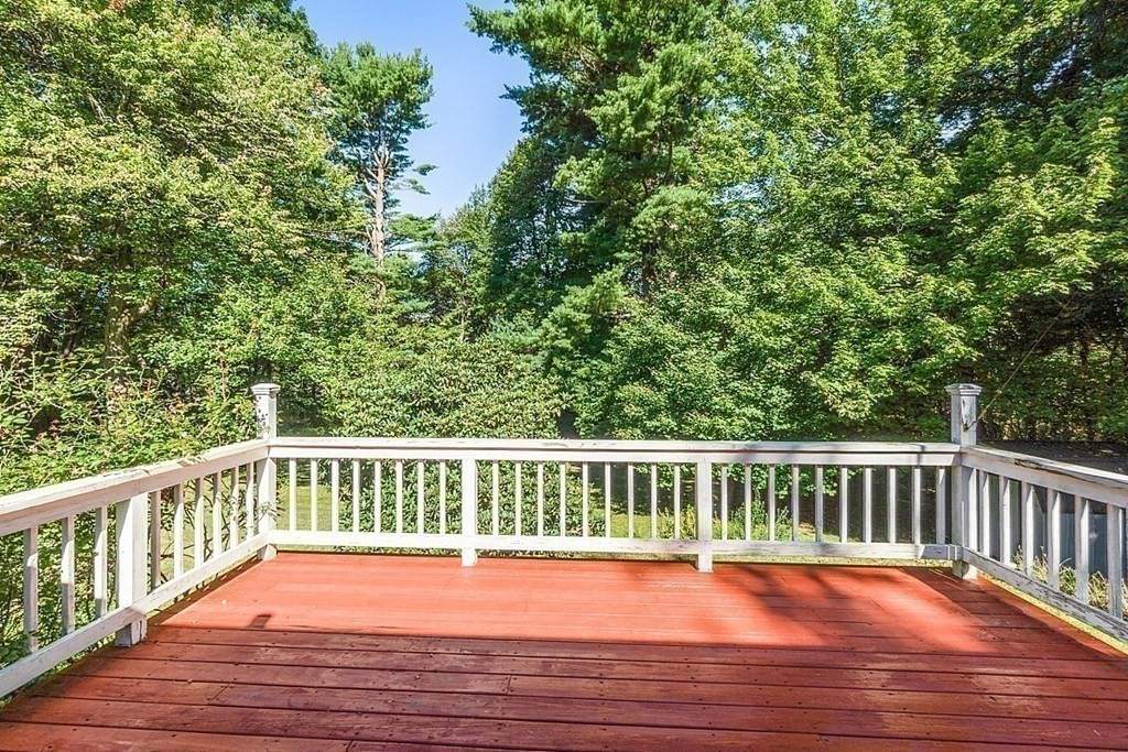 11 Mc Intosh Road Chelmsford, MA 01824 - Photo 16 of 20 a view of balcony with wooden floor and fence