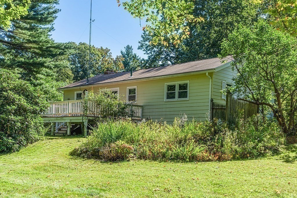 11 Mc Intosh Road Chelmsford, MA 01824 - Photo 17 of 20 a view of a house with a yard and plants
