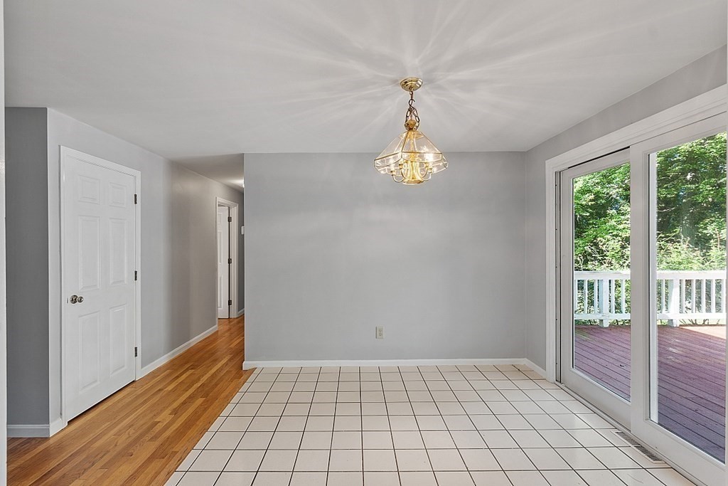 11 Mc Intosh Road Chelmsford, MA 01824 - Photo 5 of 20 a view of an empty room and window