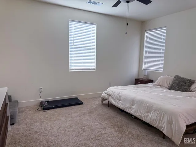 a room with a bed and a flat screen tv
