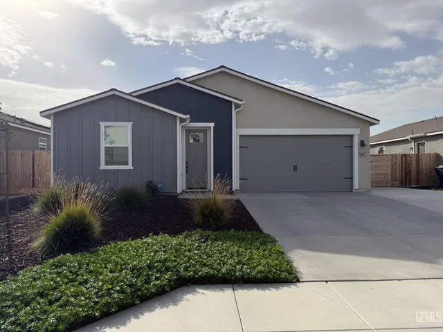 a front view of house with a yard