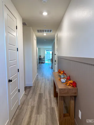 wooden floor with table and chairs in wooden floor