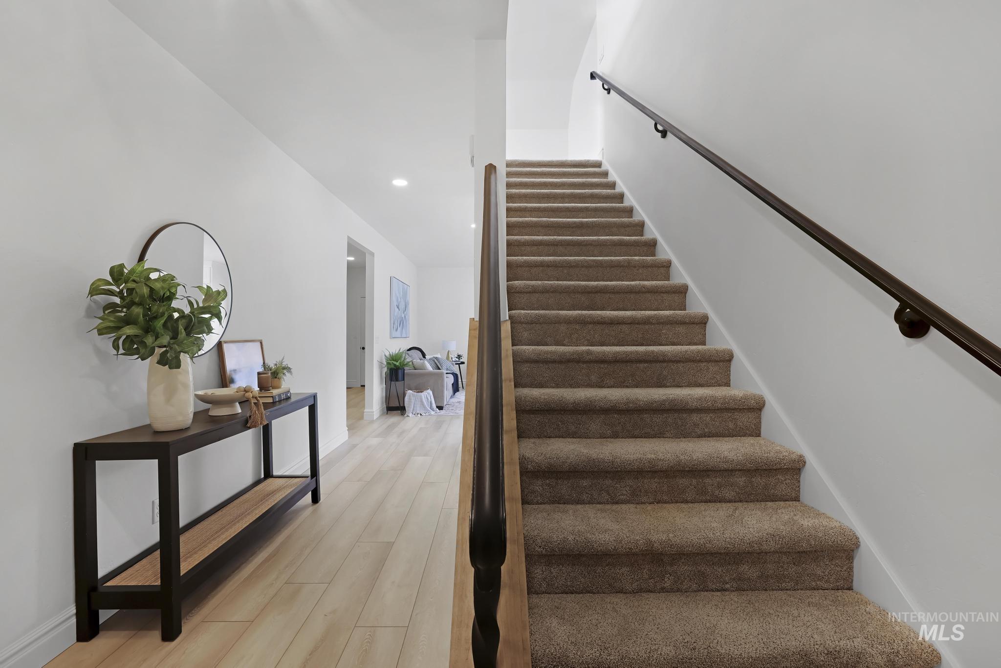 866 Quartz Road Kimberly, ID 83341 - Photo 6 of 48 Carpeted staircase with dark handrail