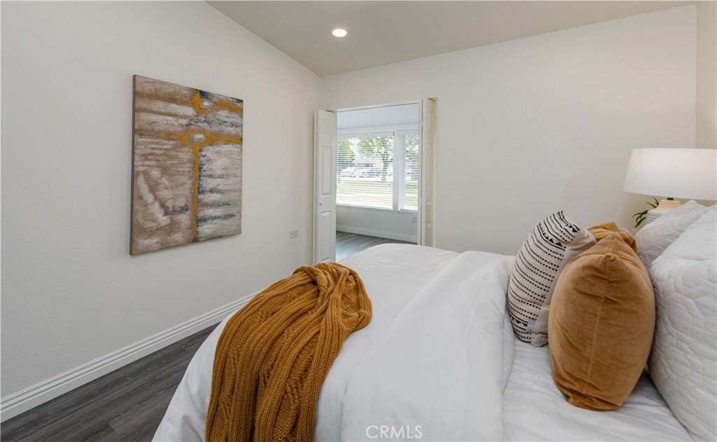 13280 St Andrews Drive, Unit 256A Seal Beach, CA 90740 - Photo 11 of 21 a bedroom with a bed and a lamp
