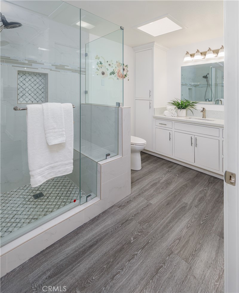 13280 St Andrews Drive, Unit 256A Seal Beach, CA 90740 - Photo 13 of 21 a bathroom with a sink and mirror