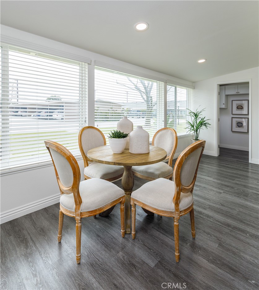 13280 St Andrews Drive, Unit 256A Seal Beach, CA 90740 - Photo 16 of 21 a dining room with furniture window and wooden floor