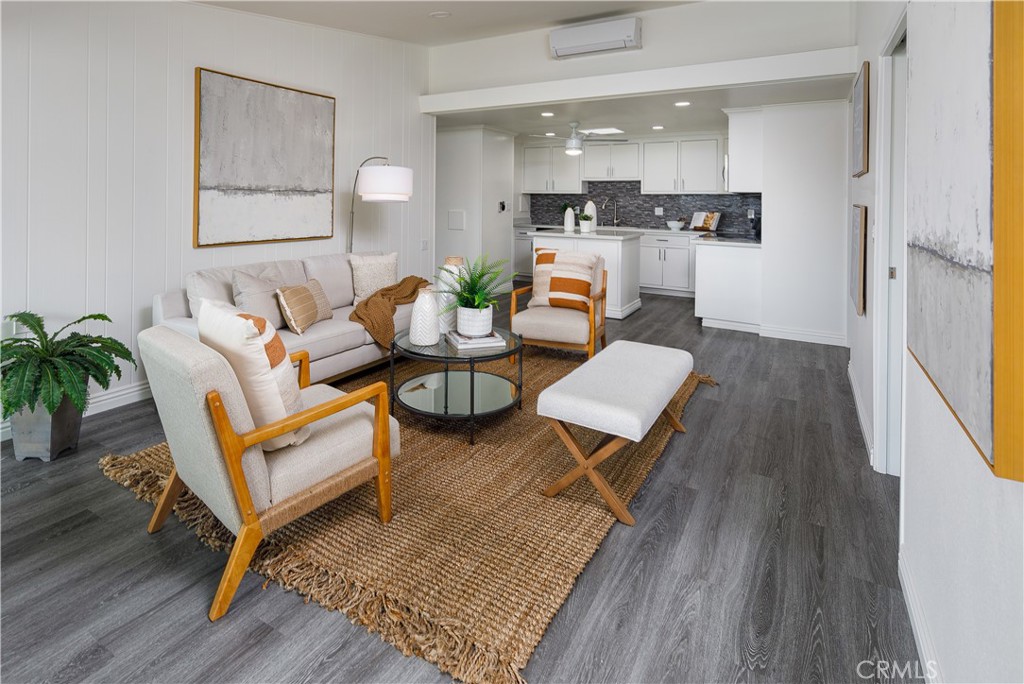13280 St Andrews Drive, Unit 256A Seal Beach, CA 90740 - Photo 3 of 21 a living room with furniture and a wooden floor