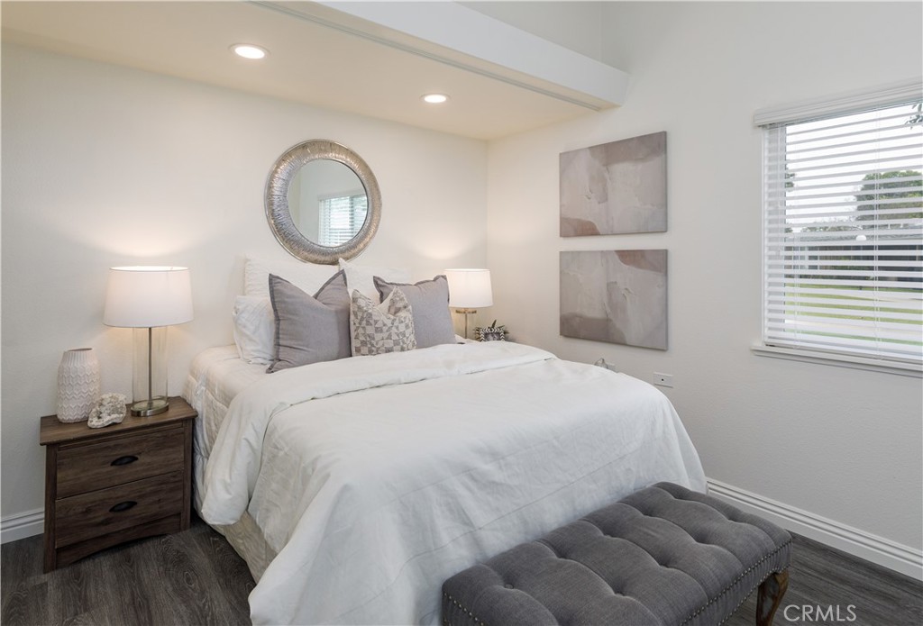 13280 St Andrews Drive, Unit 256A Seal Beach, CA 90740 - Photo 10 of 21 a bedroom with a bed and a lamp
