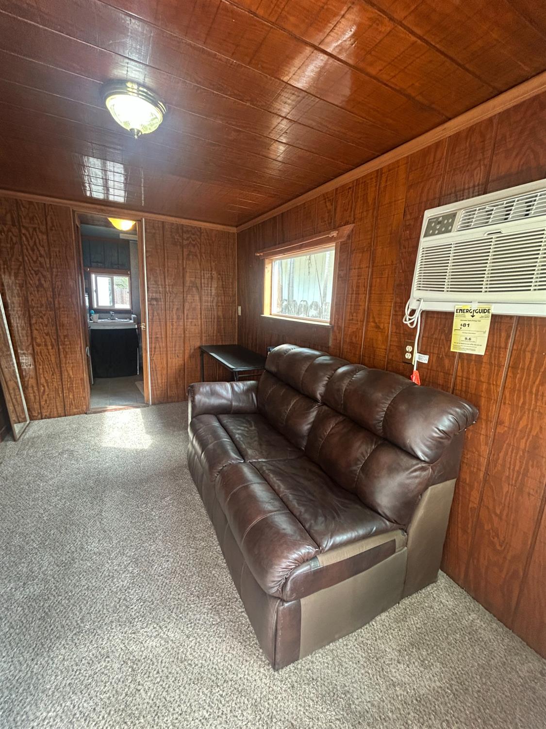 313 East Sacramento Street Coalinga, CA 93210 - Photo 20 of 23 a living room with furniture and a window