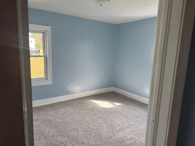 a view of an empty room and window
