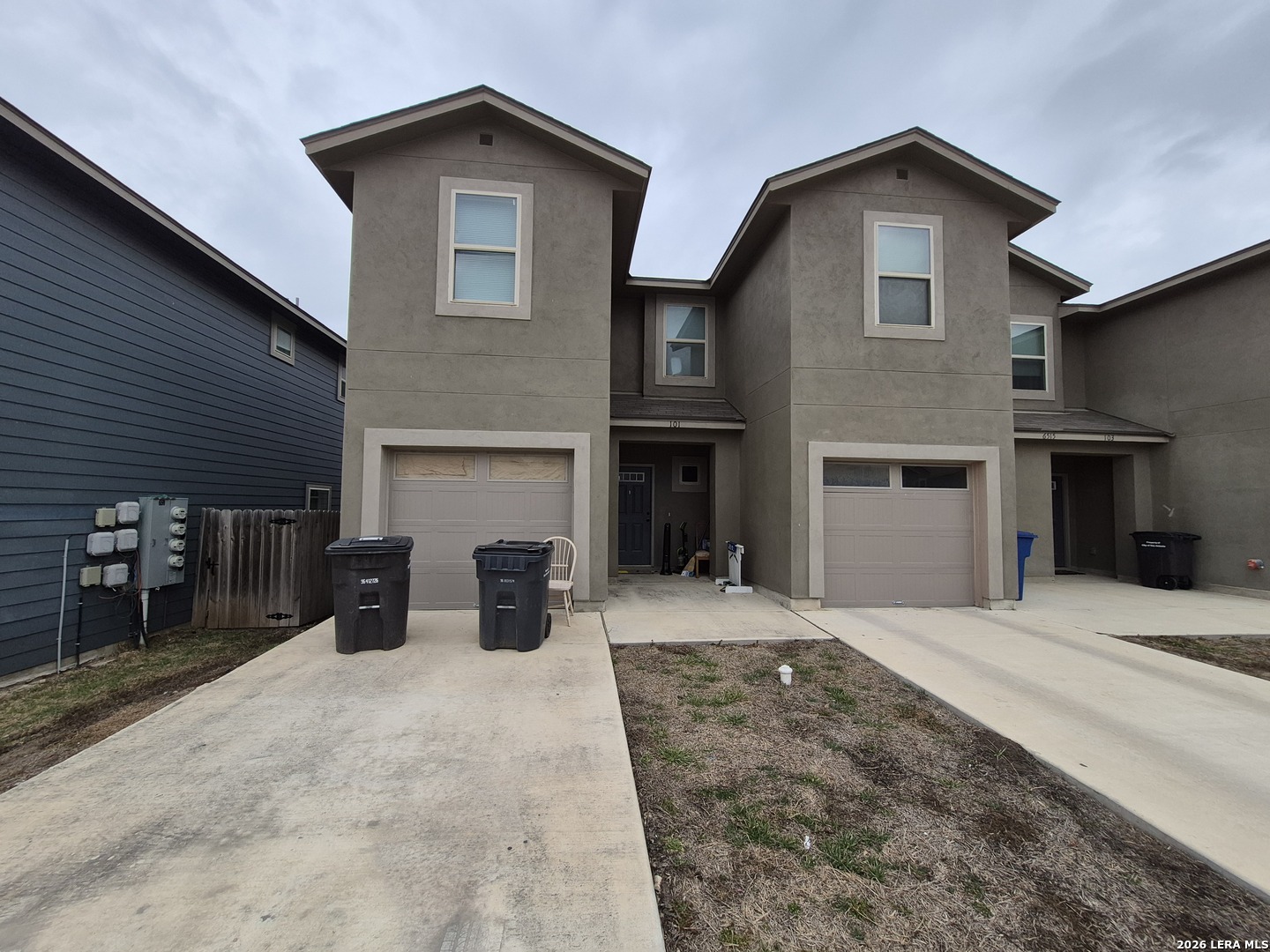 6515 Marcel Way, Unit 101 San Antonio, TX 78233 - Photo 1 of 28 a view of a house with a yard and garage