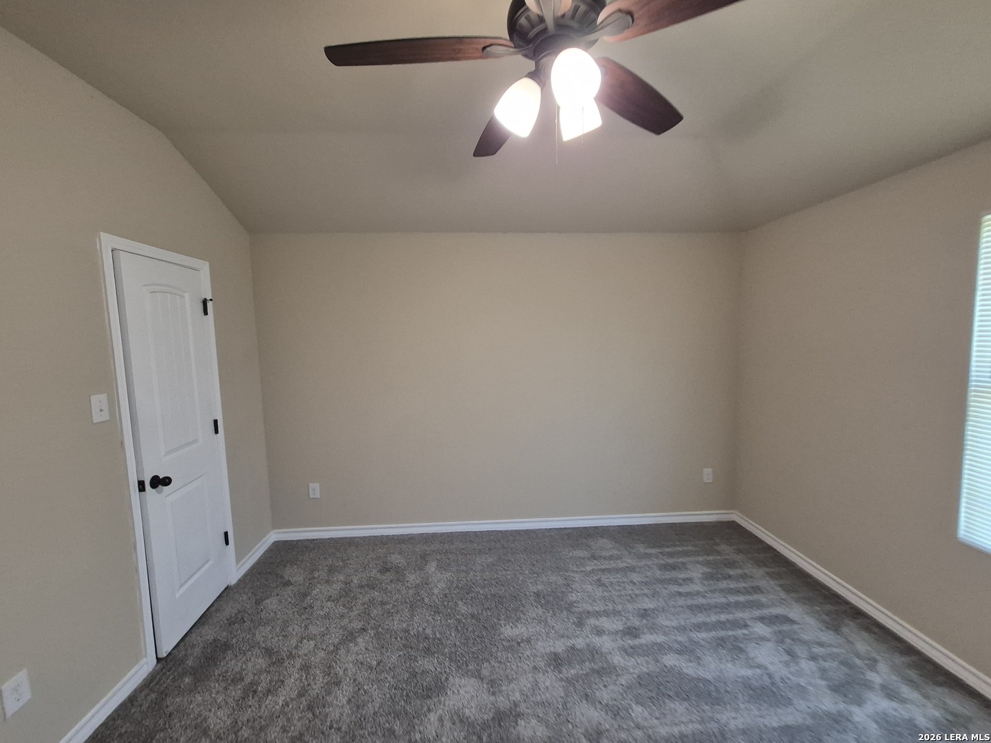 6515 Marcel Way, Unit 101 San Antonio, TX 78233 - Photo 12 of 28 an empty room with a chandelier fan and closet