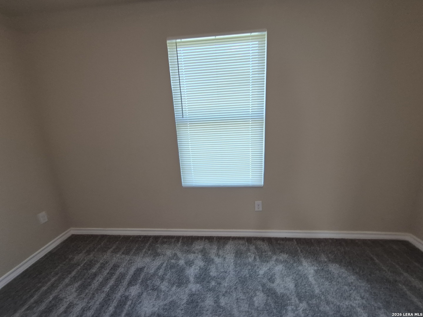 6515 Marcel Way, Unit 101 San Antonio, TX 78233 - Photo 13 of 28 a view of a small space with wooden floor and a window