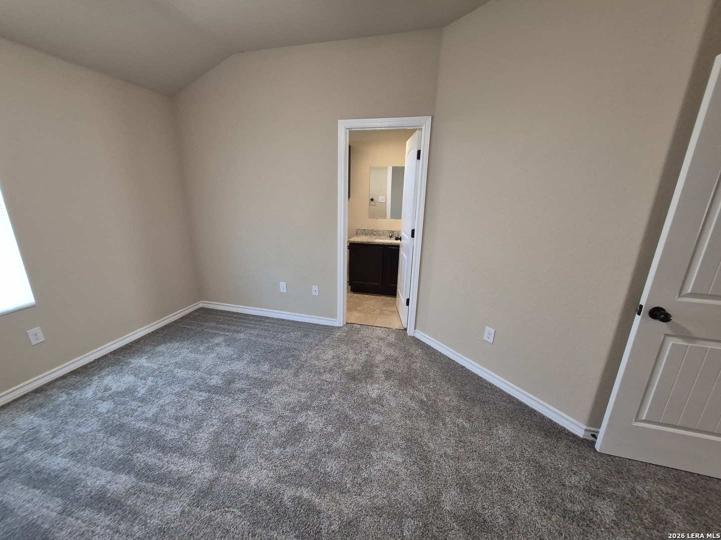 6515 Marcel Way, Unit 101 San Antonio, TX 78233 - Photo 15 of 28 an empty room with an entryway and window