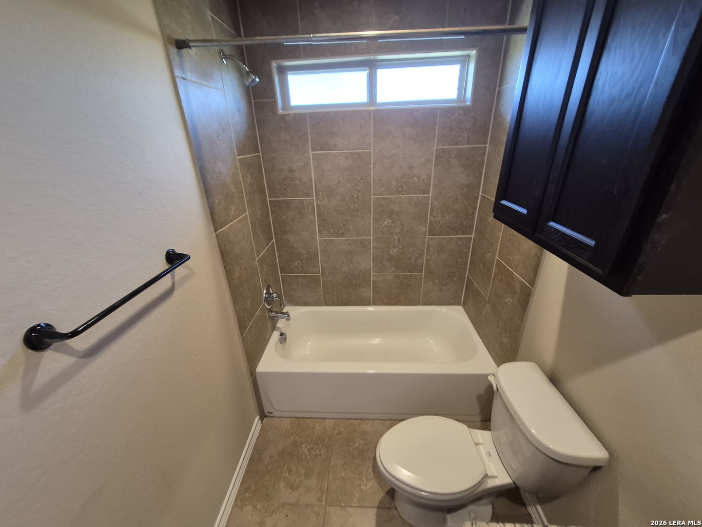 6515 Marcel Way, Unit 101 San Antonio, TX 78233 - Photo 18 of 28 a white toilet sitting next to a bath tub