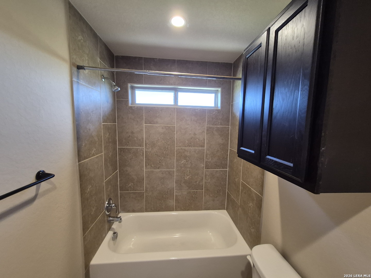 6515 Marcel Way, Unit 101 San Antonio, TX 78233 - Photo 19 of 28 a bathroom with a bathtub and a shower