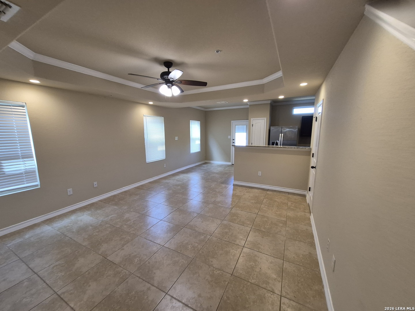 6515 Marcel Way, Unit 101 San Antonio, TX 78233 - Photo 2 of 28 a view of an empty room and a chandelier fan