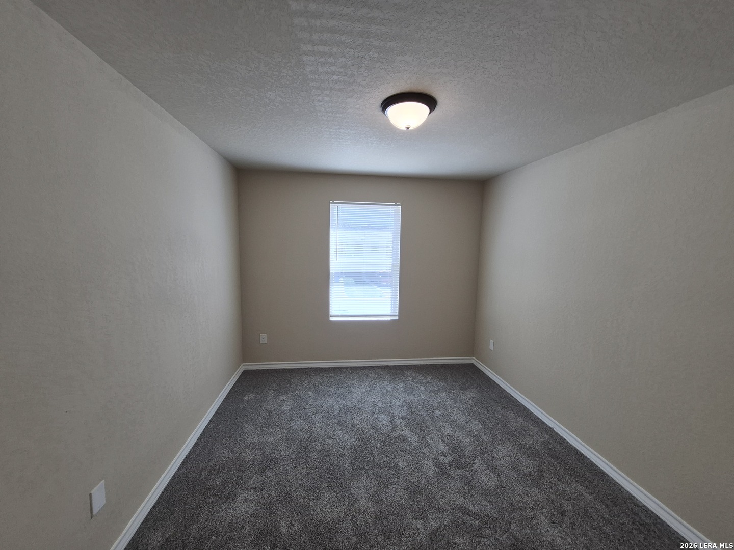 6515 Marcel Way, Unit 101 San Antonio, TX 78233 - Photo 26 of 28 an empty room with a window