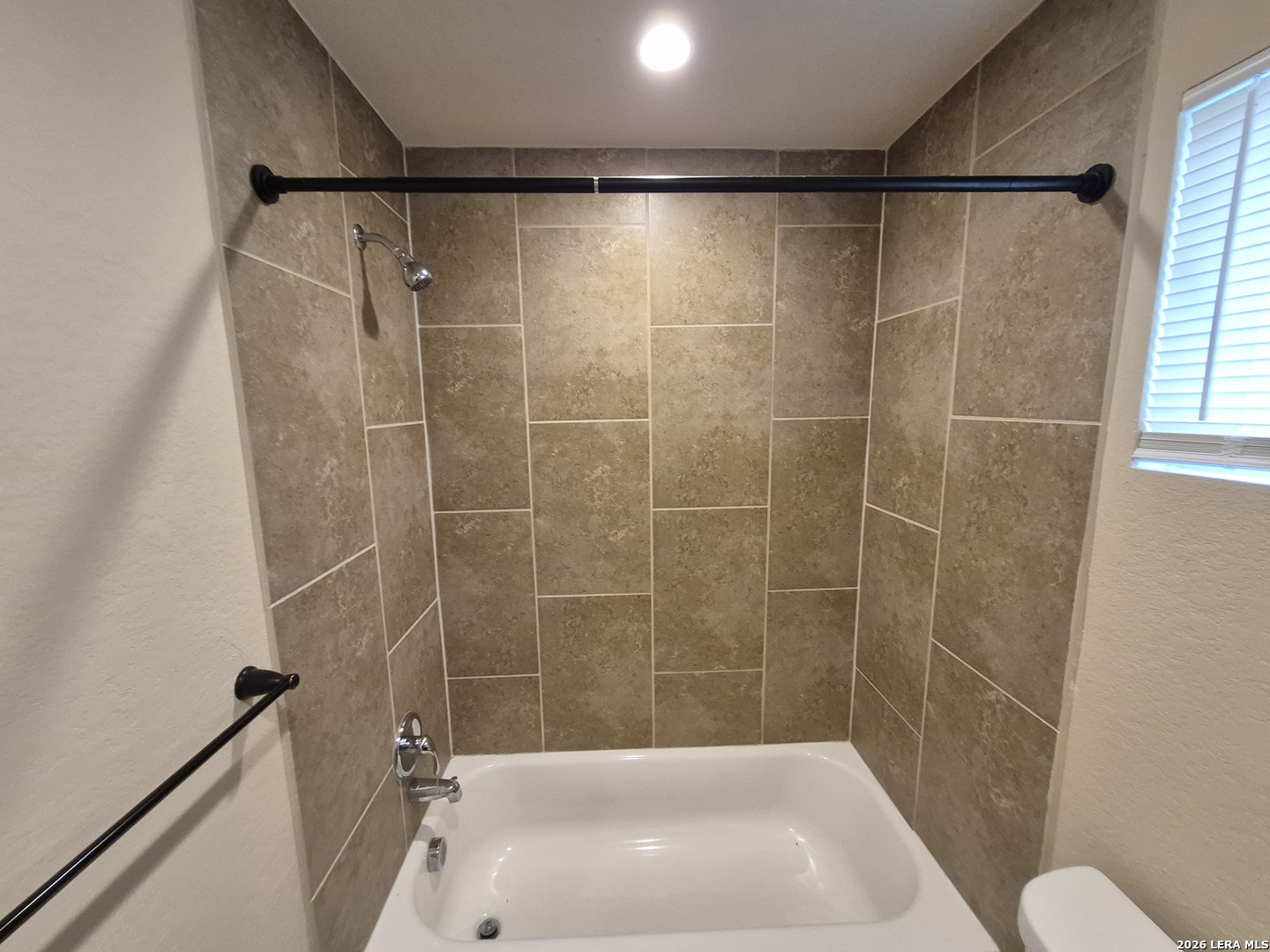 6515 Marcel Way, Unit 101 San Antonio, TX 78233 - Photo 28 of 28 a bathroom with a shower and a toilet