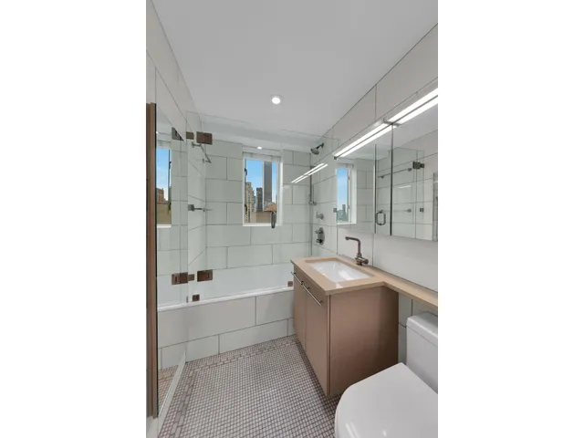 a view of hallway with stairs and a room