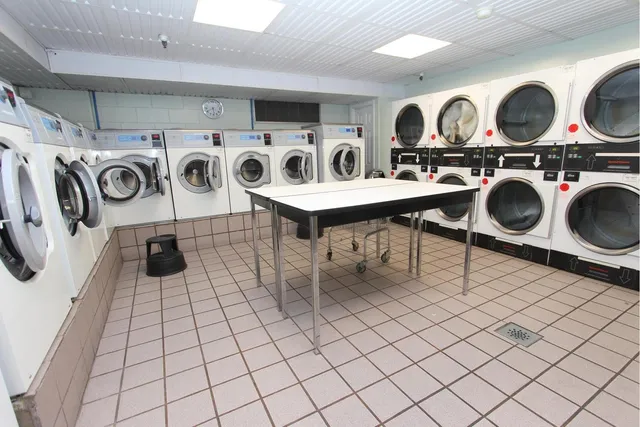 a kitchen with stainless steel appliances a sink and cabinets