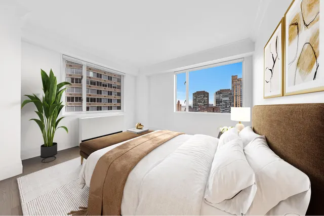 a bedroom with a bed and couch