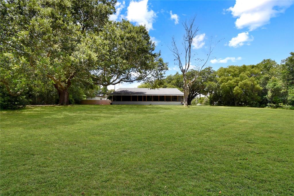 2706 Old Moultrie Road St. Augustine, FL 32086 - Photo 12 of 18 a view of a field of grass and trees