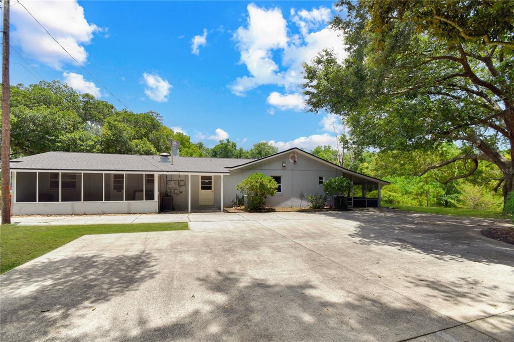 2706 Old Moultrie Road St. Augustine, FL 32086 - Photo 17 of 18 a front view of house with yard and green space