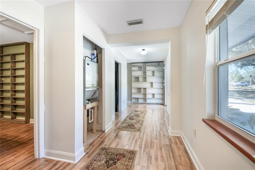 2706 Old Moultrie Road St. Augustine, FL 32086 - Photo 5 of 18 a view of a bedroom with wooden floor and windows