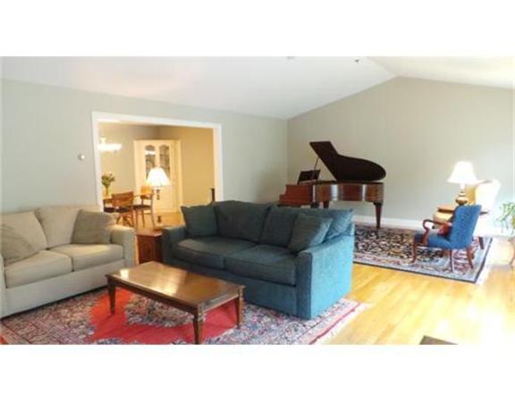 94 Mechanic Street, Unit D Foxboro, MA 02035 - Photo 12 of 30 a living room with furniture and a table