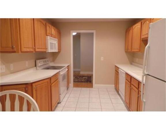 94 Mechanic Street, Unit D Foxboro, MA 02035 - Photo 15 of 30 a bathroom with a sink a mirror and a bathtub
