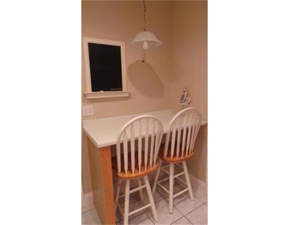 94 Mechanic Street, Unit D Foxboro, MA 02035 - Photo 16 of 30 a dinning room with a table and a chair