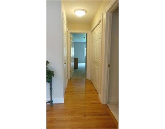94 Mechanic Street, Unit D Foxboro, MA 02035 - Photo 17 of 30 a view of a hallway with wooden floor
