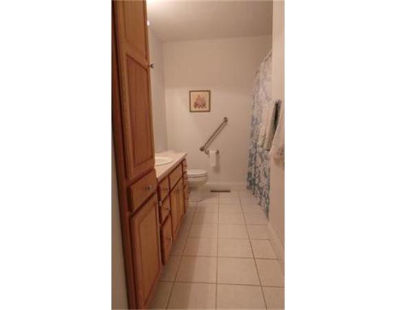 94 Mechanic Street, Unit D Foxboro, MA 02035 - Photo 19 of 30 a view of a hallway with bathroom