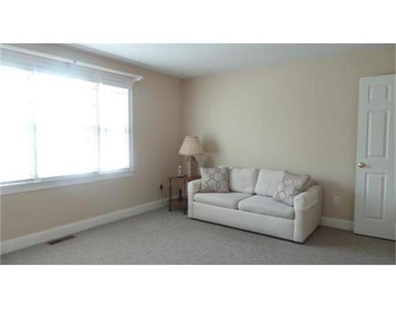 94 Mechanic Street, Unit D Foxboro, MA 02035 - Photo 24 of 30 a living room with furniture and a window
