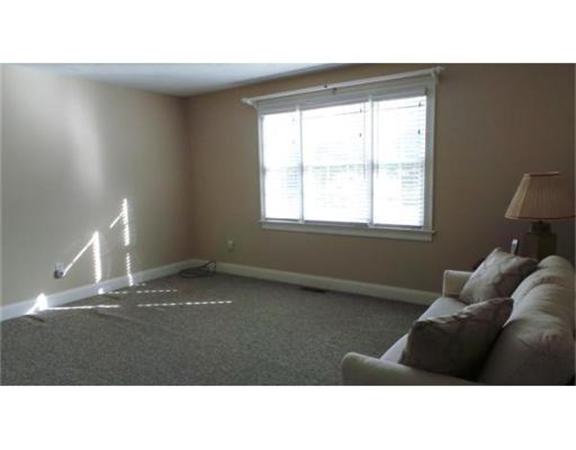 94 Mechanic Street, Unit D Foxboro, MA 02035 - Photo 25 of 30 a black and white photo of a living room