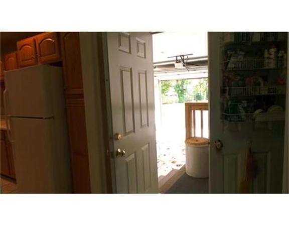 94 Mechanic Street, Unit D Foxboro, MA 02035 - Photo 26 of 30 a black and white photo of a bedroom