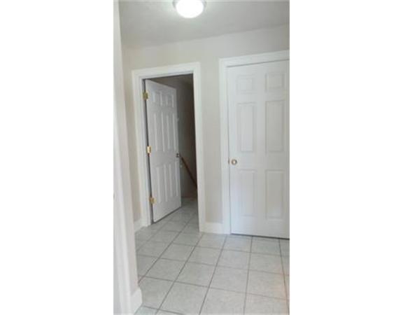 94 Mechanic Street, Unit D Foxboro, MA 02035 - Photo 27 of 30 a view of a room with a white wall