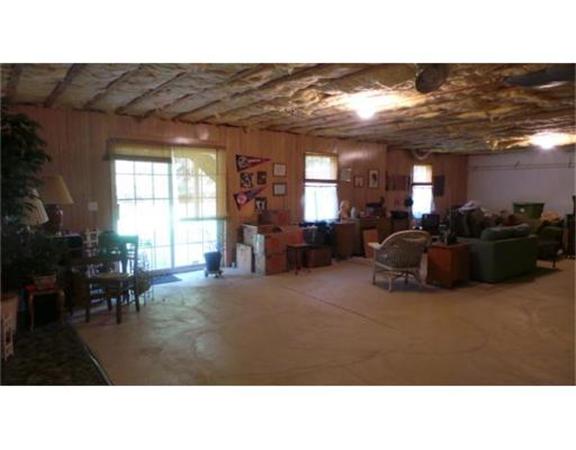 94 Mechanic Street, Unit D Foxboro, MA 02035 - Photo 29 of 30 a living room with furniture and a large window