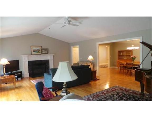 94 Mechanic Street, Unit D Foxboro, MA 02035 - Photo 4 of 30 a living room with furniture and a fireplace