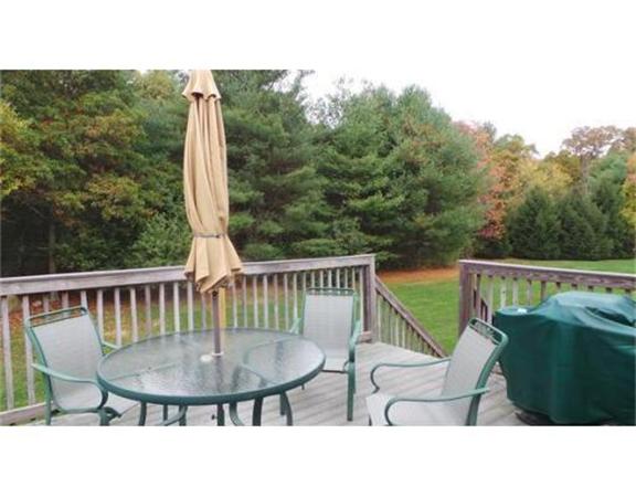 94 Mechanic Street, Unit D Foxboro, MA 02035 - Photo 5 of 30 a balcony with table and chairs