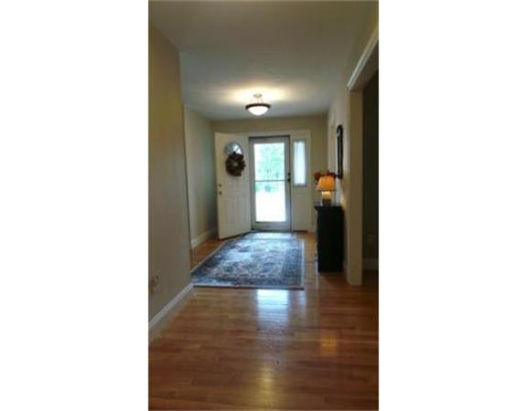 94 Mechanic Street, Unit D Foxboro, MA 02035 - Photo 9 of 30 a view of a hallway with wooden floor and a workspace